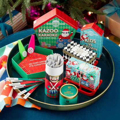 Talking Tables USA - Home, Birthday, Games & Seasonal Decor - Santa Kids vs Grown Ups Family Game - 8 Pack Display | Christmas Game |